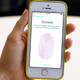The new iPhone 5S with fingerprint technology is displayed during an Apple product announcement at the Apple campus on September 10, 2013 in Cupertino, California